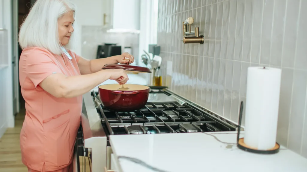Caregiver helping senior with daily living activities