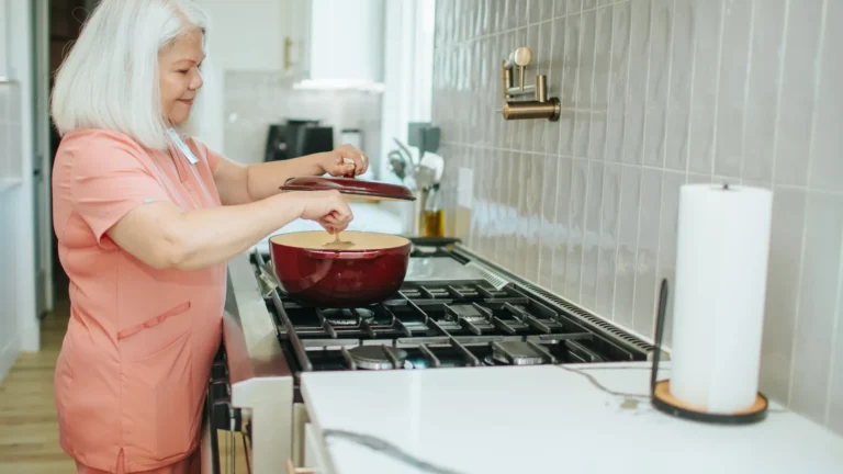 Caregiver helping senior with daily living activities