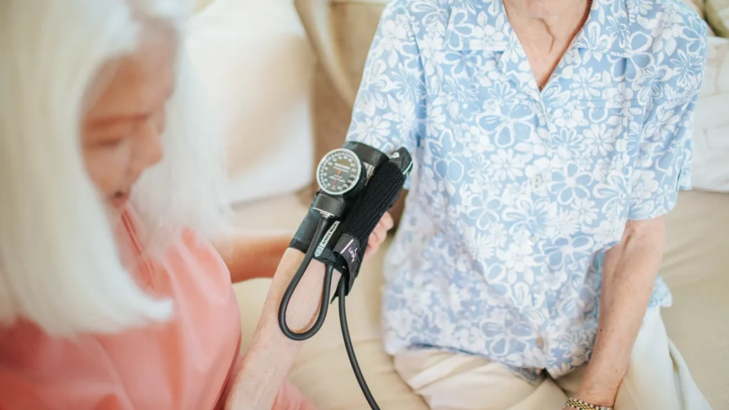 Caregiver monitoring senior during professional home care